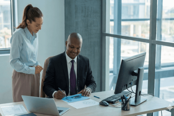 Man filing taxes on laptop in Nairobi